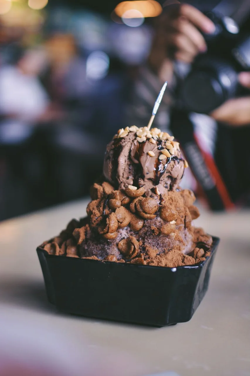 Layered chocolate dessert bowl with roasted nuts and dark ganache
