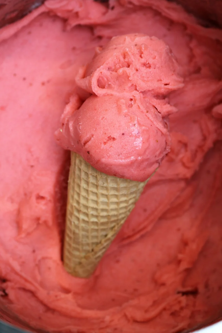 Creamy strawberry and clotted cream ice cream in cone