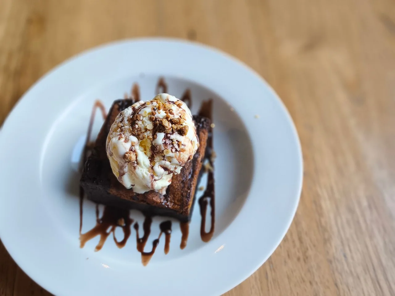 Warm chocolate fudge brownie served with vanilla ice cream